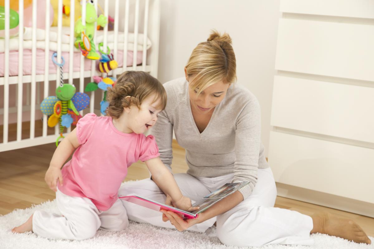 mom reading to baby